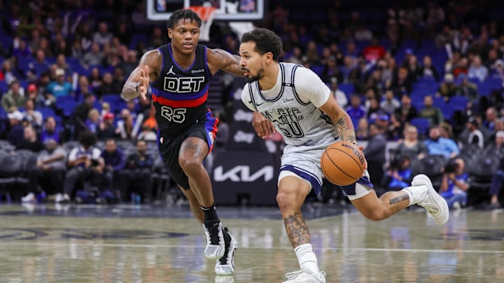 Orlando Magic guard Cole Anthony (50) brings the ball up court against Detroit Pistons guard Marcus Sasser (25) during the second half at Kia Center. Orlando Magic guard Cole Anthony (50) brings the ball up court against Detroit Pistons guard Marcus Sasser (25) during the second half at Kia Center.
