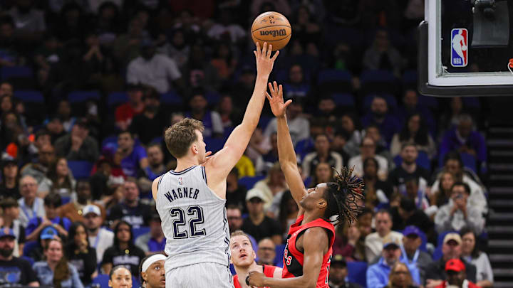 Orlando Magic forward Franz Wagner (22) shoots against Toronto Raptors guard Ja'Kobe Walter (14) during the second half at Kia Center.