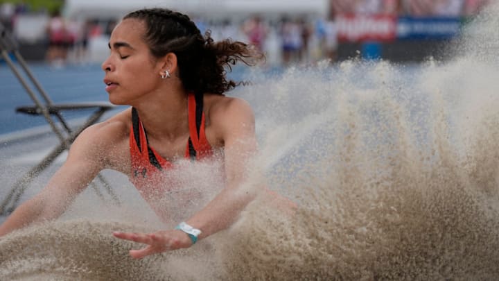 Ames’ Sophia Hatcher lands during the Class 4A girls long jump in the Iowa High School State Track and Field Meet at Drake Stadium on May 23, 2025, in Des Moines, Iowa.