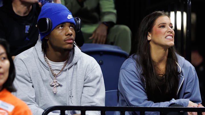 Dec 21, 2024; Gainesville, Florida, USA; Tampa Bay Tech High School wide receiver Dallas Wilson sits court side with Florida Gators assistant athletic director of recruiting strategy Katie Turner during the first half of a game against the North Florida Ospreys at Exactech Arena at the Stephen C. O'Connell Center. Mandatory Credit: Matt Pendleton-Imagn Images Dec 21, 2024; Gainesville, Florida, USA; Tampa Bay Tech High School wide receiver Dallas Wilson sits court side with Florida Gators assistant athletic director of recruiting strategy Katie Turner during the first half of a game against the North Florida Ospreys at Exactech Arena at the Stephen C. O'Connell Center. Mandatory Credit: Matt Pendleton-Imagn Images