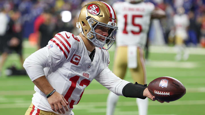 Dec 22, 2025; Indianapolis, Indiana, USA; San Francisco 49ers quarterback Brock Purdy (13) warms up before the game against the Indianapolis Colts at Lucas Oil Stadium. Mandatory Credit: Trevor Ruszkowski-Imagn Images