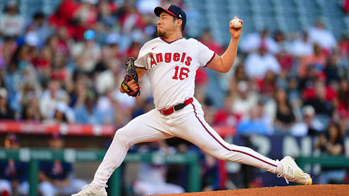 Jul 7, 2025; Anaheim, California, USA; Los Angeles Angels pitcher Yusei Kikuchi (16) throws against the Texas Rangers during the first inning at Angel Stadium. Mandatory Credit: Gary A. Vasquez-Imagn Images