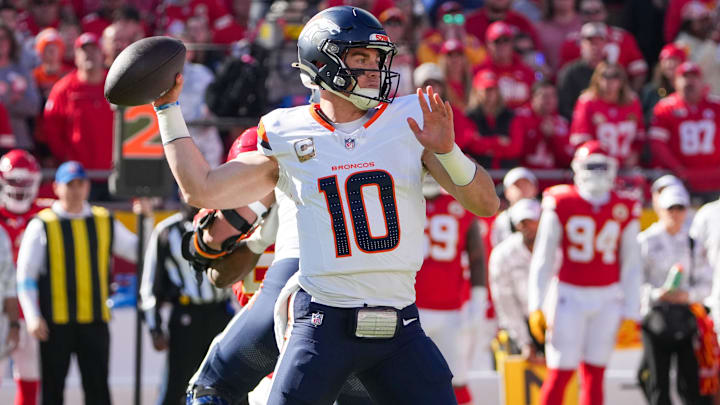 Nov 10, 2024; Kansas City, Missouri, USA; Denver Broncos quarterback Bo Nix (10) throws a pass against the Kansas City Chiefs during the first half at GEHA Field at Arrowhead Stadium. 