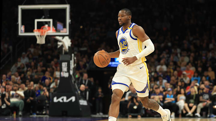 Apr 8, 2025; Phoenix, Arizona, USA; Golden State Warriors forward Jonathan Kuminga (00) against the Phoenix Suns at Footprint Center. Mandatory Credit: Mark J. Rebilas-Imagn Images