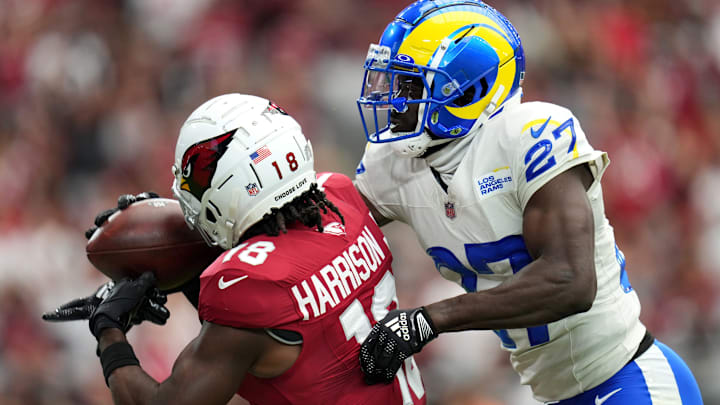 Arizona Cardinals receiver Marvin Harrison Jr. (18) catches a touchdown as Los Angeles Rams cornerback Tre'Davious White (27) defends at State Farm Stadium.