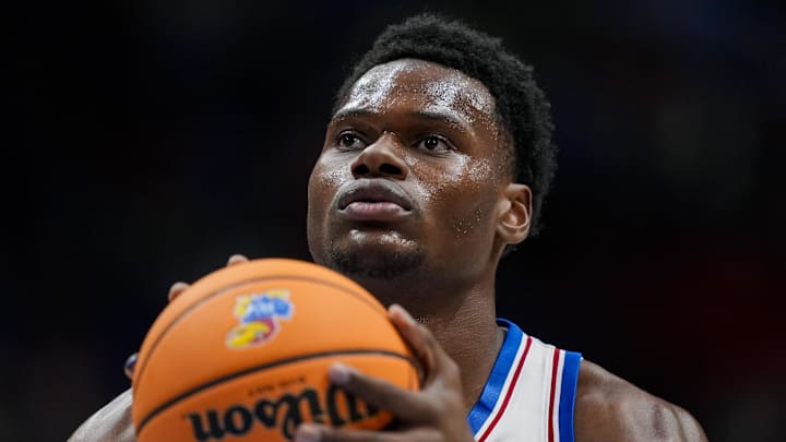 Nov 3, 2025; Lawrence, Kansas, USA; Kansas Jayhawks center Paul Mbiya (34) shoots a free throw during the second half against the Green Bay Phoenix at Allen Fieldhouse. Mandatory Credit: Jay Biggerstaff-Imagn Images