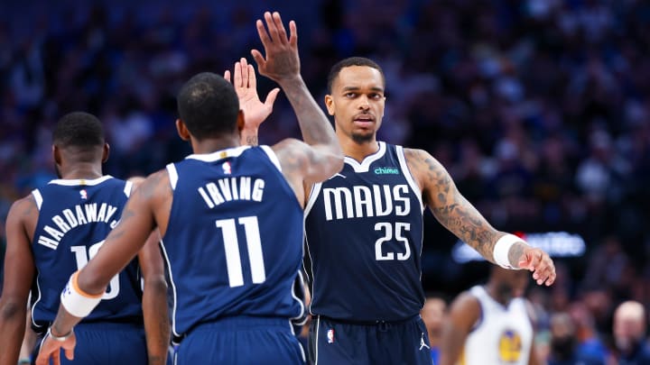 Apr 5, 2024; Dallas, Texas, USA;  Dallas Mavericks guard Kyrie Irving (11) celebrates with Dallas