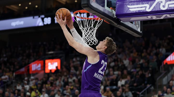 Feb 12, 2025; Salt Lake City, Utah, USA;  Utah Jazz forward Lauri Markkanen (23) dunks during the second half against the Los Angeles Lakers at Delta Center. Mandatory Credit: Chris Nicoll-Imagn Images