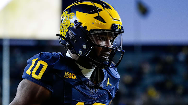 Michigan quarterback Alex Orji (10) warms up before the Michigan State game at Michigan Stadium in Ann Arbor on Saturday, Oct. 26, 2024. Michigan quarterback Alex Orji (10) warms up before the Michigan State game at Michigan Stadium in Ann Arbor on Saturday, Oct. 26, 2024.