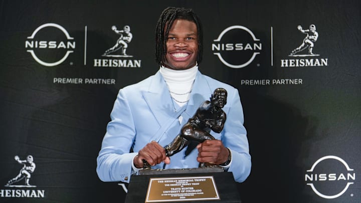 Colorado Buffaloes wide receiver/cornerback Travis Hunter poses for a photo after winning the Heisman Trophy award during the 2024 Heisman Trophy Presentation. 