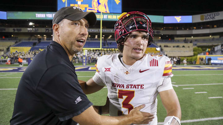 Oct 12, 2024; Morgantown, West Virginia, USA; Iowa State Cyclones head coach Matt Campbell celebrates with quarterback Rocco Becht (3) after defeating the West Virginia Mountaineers at Mountaineer Field at Milan Puskar Stadium. Mandatory Credit: Ben Queen-Imagn Images Oct 12, 2024; Morgantown, West Virginia, USA; Iowa State Cyclones head coach Matt Campbell celebrates with quarterback Rocco Becht (3) after defeating the West Virginia Mountaineers at Mountaineer Field at Milan Puskar Stadium. Mandatory Credit: Ben Queen-Imagn Images