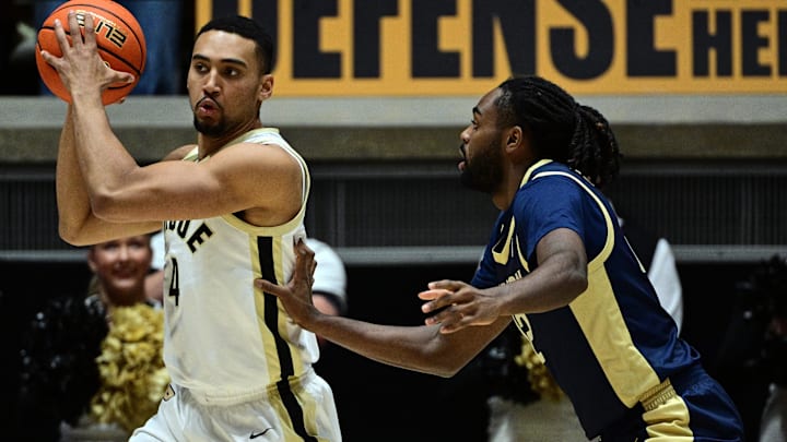 Purdue Boilermakers forward Trey Kaufman-Renn (4) looks for an open teammate Purdue Boilermakers forward Trey Kaufman-Renn (4) looks for an open teammate