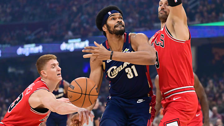 Nov 8, 2025; Cleveland, Ohio, USA; Chicago Bulls guard Kevin Huerter (13) knocks the ball away from Cleveland Cavaliers center Jarrett Allen (31) during the first quarter at Rocket Arena. Mandatory Credit: Ken Blaze-Imagn Images