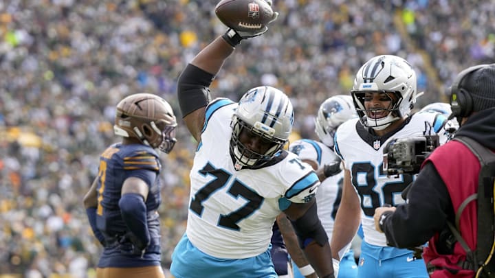 Tackle Yosh Nijman gets to celebrate with a spike after a Panthers T in a win over the Packers.