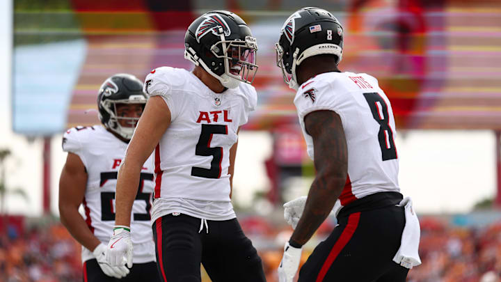 Oct 27, 2024; Tampa, Florida, USA; Atlanta Falcons wide receiver Drake London (5) congratulates tight end Kyle Pitts (8) after scoring a touchdown against the Tampa Bay Buccaneers in the second quarter at Raymond James Stadium. Mandatory Credit: Nathan Ray Seebeck-Imagn Images