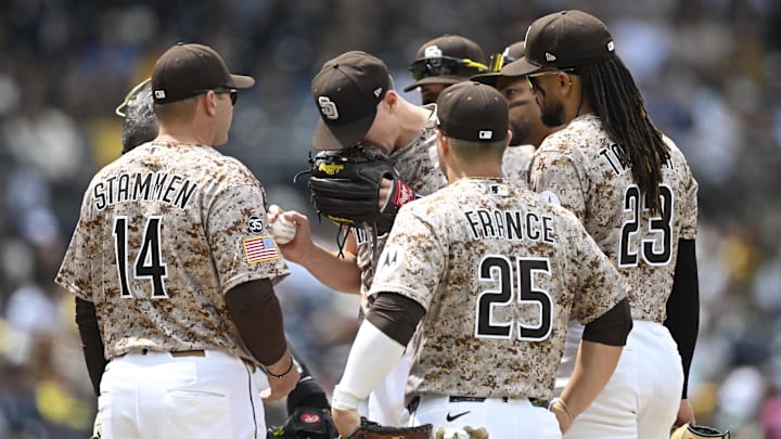 Apr 12, 2026; San Diego, California, USA; San Diego Padres starting pitcher Nick Pivetta (27), center, reacts before leaving the game during the fourth inning against the Colorado Rockies at Petco Park. Mandatory Credit: Denis Poroy-Imagn Images