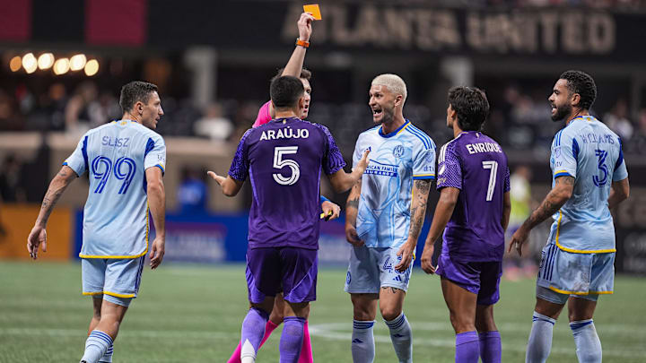 May 28, 2025; Atlanta, Georgia, USA; Players argue after Orlando City midfielder Cesar Araujo (5) grabbed the throat of Atlanta United midfielder Mateusz Klich (43), causing a red card to be issued against him during the second half at Mercedes-Benz Stadium. Mandatory Credit: Dale Zanine-Imagn Images