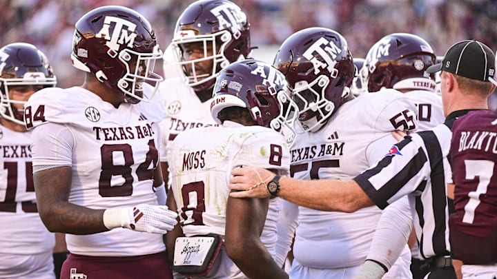 Oct 19, 2024; Starkville, Mississippi, USA;  Texas A&M Aggies running back Le'Veon Moss (8) reacts with teammates after a touchdown against the Mississippi State Bulldogs during the third quarter at Davis Wade Stadium at Scott Field. Mandatory Credit: Matt Bush-Imagn Images