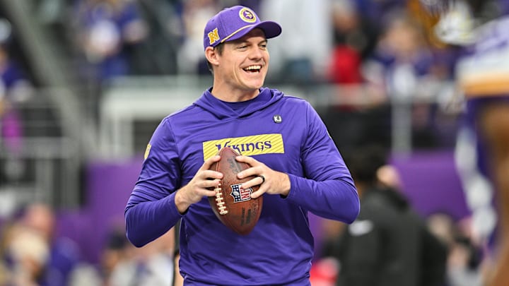 Dec 8, 2024; Minneapolis, Minnesota, USA; Minnesota Vikings head coach Kevin O'Connell warms up with his players before the game against the Atlanta Falcons at U.S. Bank Stadium.