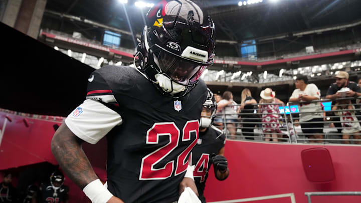 Arizona Cardinals running back Michael Carter (22) takes the field before they play against the Tennessee Titans at State Farm Stadium in Glendale on Oct. 5, 2025. Arizona Cardinals running back Michael Carter (22) takes the field before they play against the Tennessee Titans at State Farm Stadium in Glendale on Oct. 5, 2025.