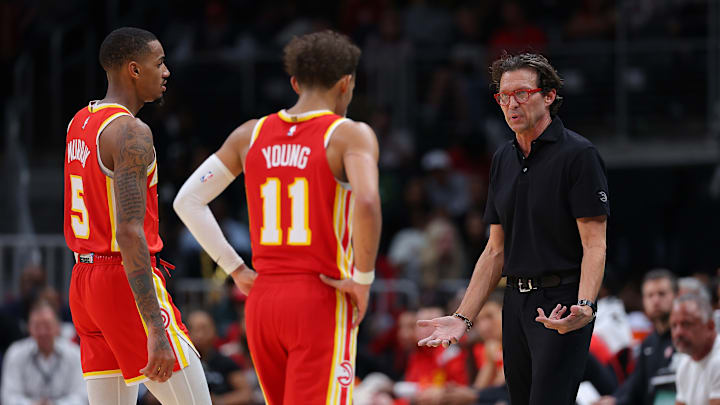 Atlanta Hawks guards Dejounte Murray and Trae Young and Head Coach Quin Snyder
