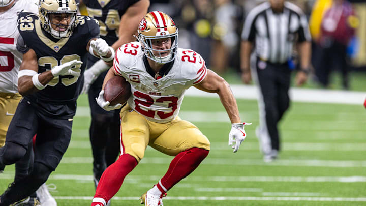 San Francisco 49ers running back Christian McCaffrey runs against New Orleans Saints safety Jonas Sanker