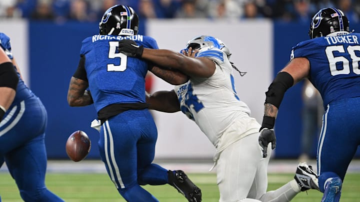 Nov 24, 2024; Indianapolis, Indiana, USA; Indianapolis Colts quarterback Anthony Richardson (5) fumbles the ball when hit by Detroit Lions defensive tackle Alim McNeill (54) during the second half at Lucas Oil Stadium. Nov 24, 2024; Indianapolis, Indiana, USA; Indianapolis Colts quarterback Anthony Richardson (5) fumbles the ball when hit by Detroit Lions defensive tackle Alim McNeill (54) during the second half at Lucas Oil Stadium.
