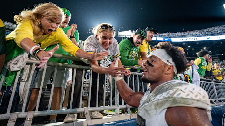 Oregon tight end Kenyon Sadiq celebrates with fans as the Oregon Ducks face the Penn State Nittany Lions on Sept. 27, 2025, at Beaver Stadium in University Park, Pennsylvania.