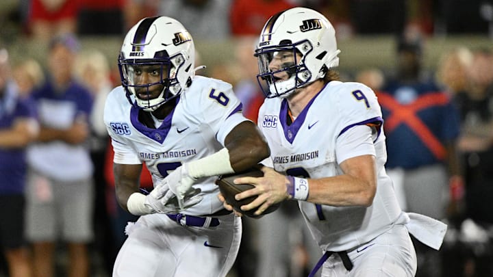 James Madison Dukes quarterback Matthew Sluka (9) fakes a handoff to running back George Pettaway (6)