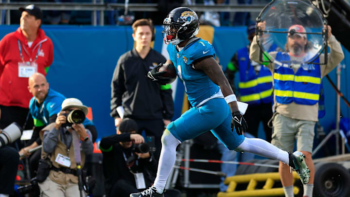 Jacksonville Jaguars running back Travis Etienne Jr. (1) scores a touchdown during the fourth quarter of an NFL football AFC Wild Card playoff matchup, Sunday, Jan. 11, 2026, in Jacksonville, Fla. The Bills defeated the Jaguars 27-24.