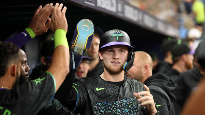 May 3, 2024; St. Petersburg, Florida, USA; Tampa Bay Rays second base Curtis Mead (25) is congratulated in the dugout after he scored a run against the New York Mets during the second inning at Tropicana Field. Mandatory Credit: Kim Klement Neitzel-Imagn Images
