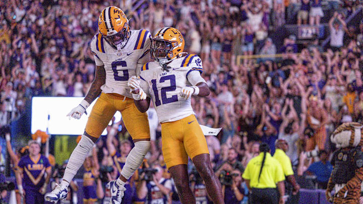 Oct 11, 2025; Baton Rouge, Louisiana, USA;  LSU Tigers wide receiver Barion Brown (6) celebrates a touchdown with wide receiver Kyle Parker (12) against the South Carolina Gamecocks during the second half at Tiger Stadium. Mandatory Credit: Stephen Lew-Imagn Images