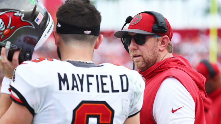 Sep 8, 2024; Tampa, Florida, USA; Tampa Bay Buccaneers quarterback Baker Mayfield (6) talks with offensive coordinator Liam Coen against the Washington Commanders during the first half at Raymond James Stadium. Mandatory Credit: Kim Klement Neitzel-Imagn Images Sep 8, 2024; Tampa, Florida, USA; Tampa Bay Buccaneers quarterback Baker Mayfield (6) talks with offensive coordinator Liam Coen against the Washington Commanders during the first half at Raymond James Stadium. Mandatory Credit: Kim Klement Neitzel-Imagn Images