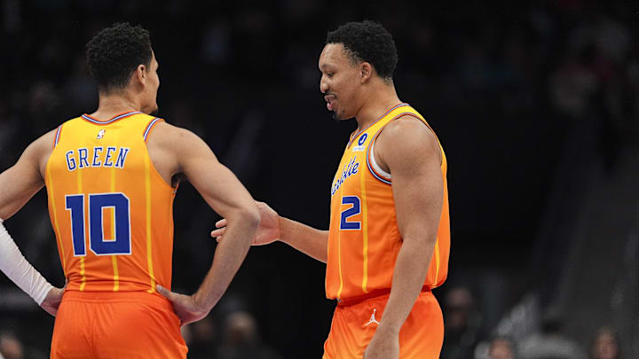 Jan 24, 2026; Charlotte, North Carolina, USA; Charlotte Hornets forward Grant Williams (2) chats with guard Josh Green (10) during the first quarter against the Washington Wizards at the Spectrum Center. Mandatory Credit: Jim Dedmon-Imagn Images