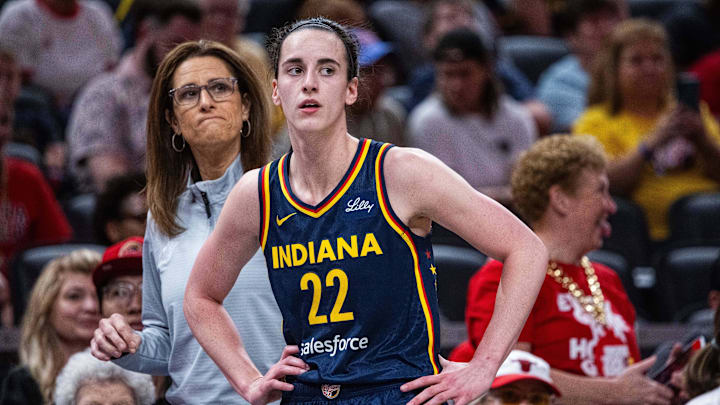 Jun 17, 2025; Indianapolis, Indiana, USA; Indiana Fever guard Caitlin Clark (22)  and head coach Stephanie White in the first half against the Connecticut Sun at Gainbridge Fieldhouse. Mandatory Credit: Trevor Ruszkowski-Imagn Images