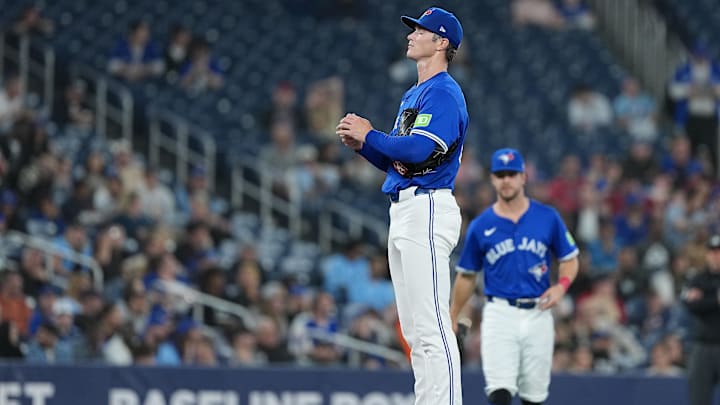 Apr 14, 2025: Toronto Blue Jays starting pitcher Easton Lucas (62) takes a moment on the mound before delivering a pitch against the Atlanta Braves during the fifth inning at Rogers Centre. 