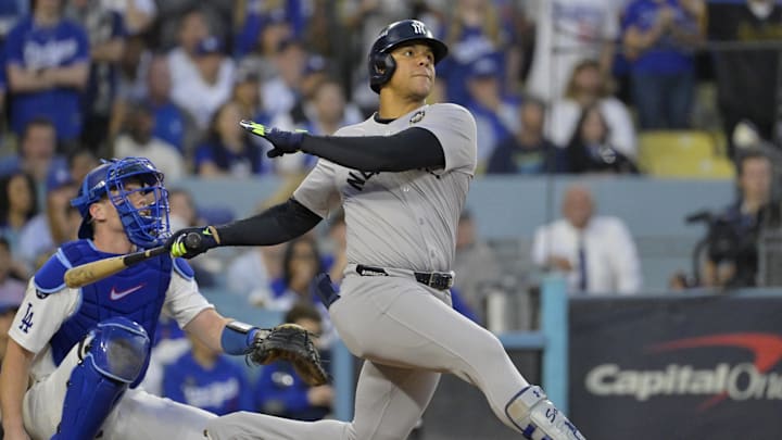 Oct 26, 2024; Los Angeles, California, USA; New York Yankees outfielder Juan Soto (22) hits a solo home run in the third inning against the Los Angeles Dodgers during game two of the 2024 MLB World Series at Dodger Stadium. 