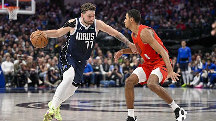 Jan 3, 2024; Dallas, Texas, USA; Dallas Mavericks guard Luka Doncic (77) drives to the basket past Portland Trail Blazers forward Kris Murray (8) during the second half at the American Airlines Center. Mandatory Credit: Jerome Miron-Imagn Images Jan 3, 2024; Dallas, Texas, USA; Dallas Mavericks guard Luka Doncic (77) drives to the basket past Portland Trail Blazers forward Kris Murray (8) during the second half at the American Airlines Center. Mandatory Credit: Jerome Miron-Imagn Images