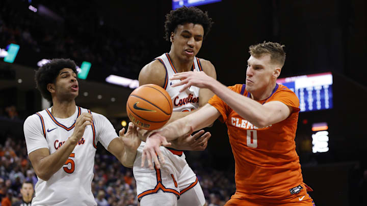 Mar 1, 2025; Charlottesville, Virginia, USA; Clemson Tigers center Viktor Lakhin (0) battles for a rebound with Virginia Cavaliers forward Anthony Robinson (21) and Cavaliers forward Jacob Cofie (5) during the second half at John Paul Jones Arena. Mar 1, 2025; Charlottesville, Virginia, USA; Clemson Tigers center Viktor Lakhin (0) battles for a rebound with Virginia Cavaliers forward Anthony Robinson (21) and Cavaliers forward Jacob Cofie (5) during the second half at John Paul Jones Arena.