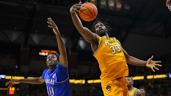 Dec 8, 2024; Columbia, Missouri, USA; Missouri Tigers center Josh Gray (33) grabs a rebound against Kansas Jayhawks forward Flory Bidunga (40) during the second half at Mizzou Arena. Mandatory Credit: Jay Biggerstaff-Imagn Images Dec 8, 2024; Columbia, Missouri, USA; Missouri Tigers center Josh Gray (33) grabs a rebound against Kansas Jayhawks forward Flory Bidunga (40) during the second half at Mizzou Arena. Mandatory Credit: Jay Biggerstaff-Imagn Images