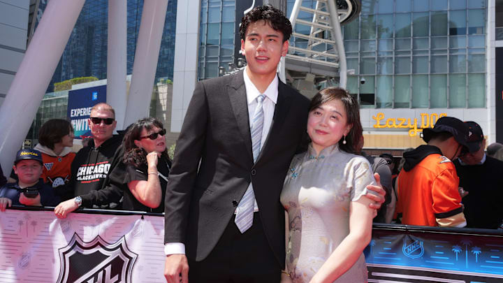 Jun 27, 2025; Los Angeles, California, USA; Simon Wang, with his mother, Willa, arrive to the first round of the 2025 NHL Draft at Peacock Theater. Mandatory Credit: Kirby Lee-Imagn Images