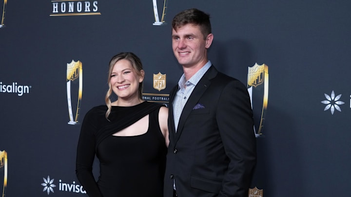 Dallas Cowboys kicker Brandon Aubrey and wife Jenn Aubrey pose on the NFL Honors Red Carpet before Super Bowl LX 