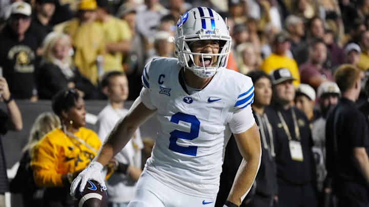 Sep 27, 2025; Boulder, Colorado, USA; Brigham Young Cougars wide receiver Chase Roberts (2) celebrates his touchdown reception in the second quarter against the Colorado Buffaloes at Folsom Field. Mandatory Credit: Ron Chenoy-Imagn Images