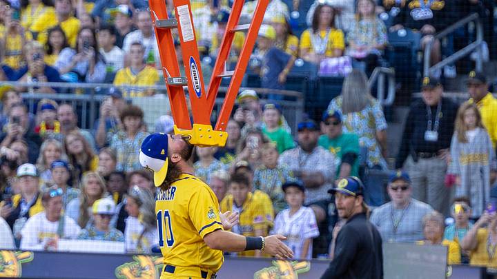 Savannah Banana first baseman Alex Ziegler (10) balances a ladder on his chin ahead of the Savannah Bananas game against the Texas Tailgaters Saturday, Aug. 30, 2025 at PNC Park in Pittsburgh, Pa.