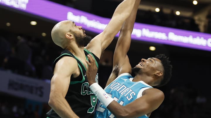 Nov 2, 2024; Charlotte, North Carolina, USA; Charlotte Hornets forward Brandon Miller (24) shoots the ball against Boston Celtics guard Derrick White (9) during the second half at Spectrum Center. Mandatory Credit: Nell Redmond-Imagn Images