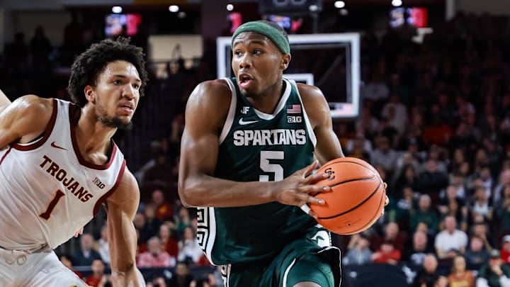 Feb 1, 2025; Los Angeles, California, USA;  Michigan State Spartans guard Tre Holloman (5) dribbles down the sideline against the USC Trojans at Galen Center. Mandatory Credit: William Navarro-Imagn Images