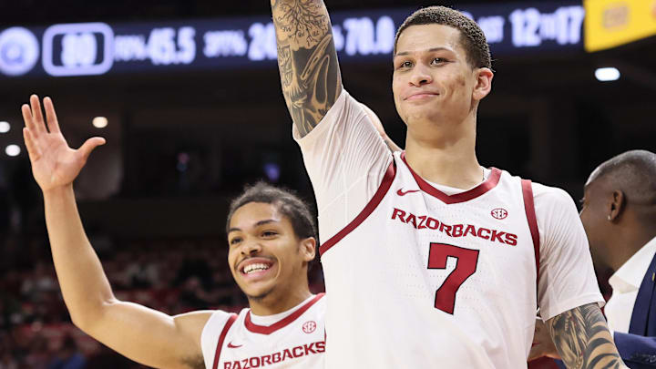 Arkansas Razorbacks guard Darius Acuff Jr (5) and forward Trevon Brazile (7) celebrate from the bench after a play against the Queens Royals during the second half at Bud Walton Arena. Arkansas won 108-80. 