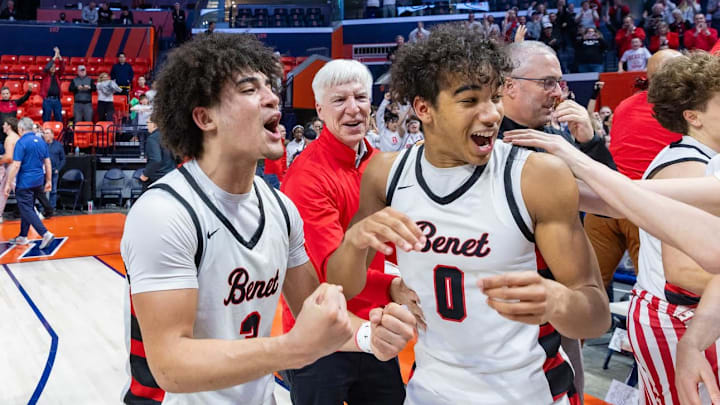Benet's Jayden Wright (left) and Blake Fagbemi celebrate the Redwings' 55-54 win over Warren in the IHSA Class 4A state championship game on March 15 in Champaign.
