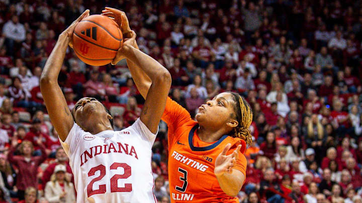 Indiana's Chloe Moore-McNeil (22) is blocked by Illinois' Makira Cook (3) during the second half of the game. 