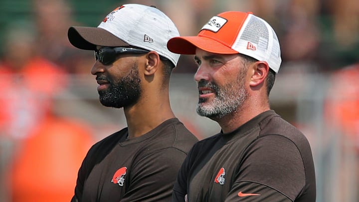 Browns GM Andrew Berry, left, and coach Kevin Stefanski watch practice in training camp, Saturday, July 31, 2021, in Berea.